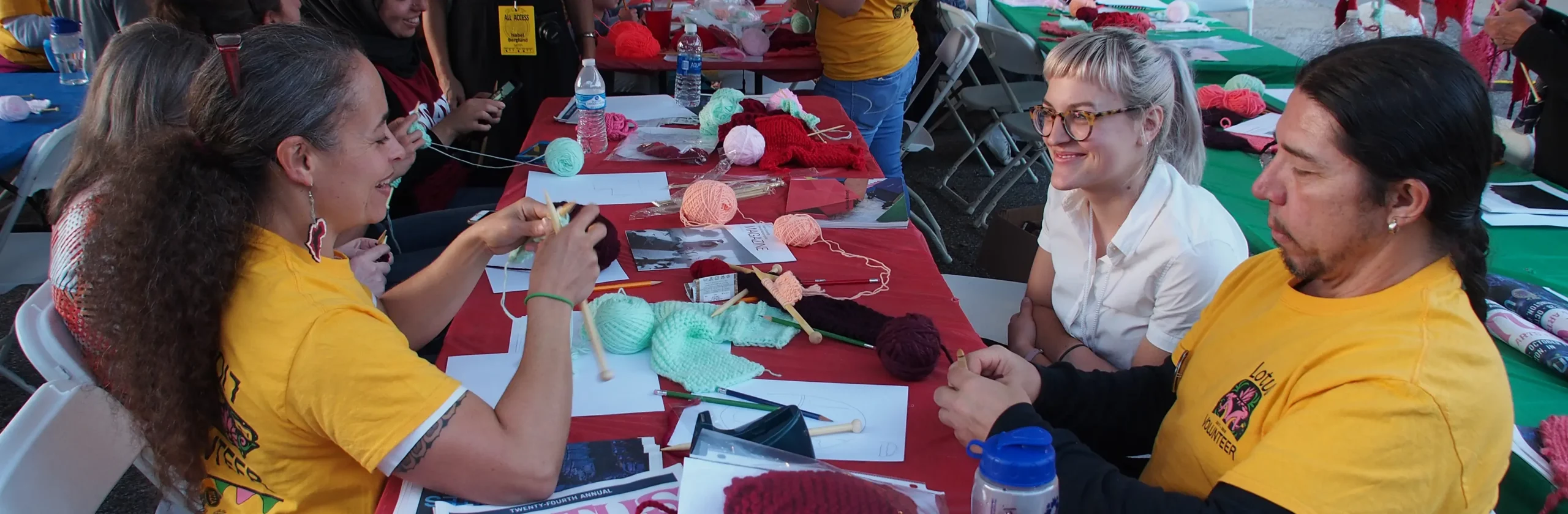 banner of man and woman knitting during an event