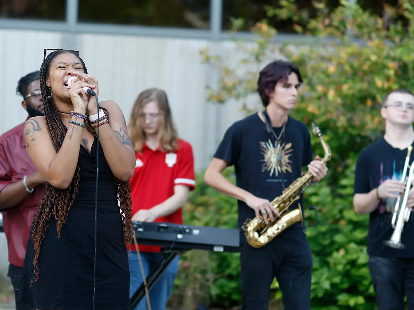 singer and band perform